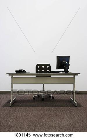 Stock Photography - Bare office desk with computer and phone. Fotosearch