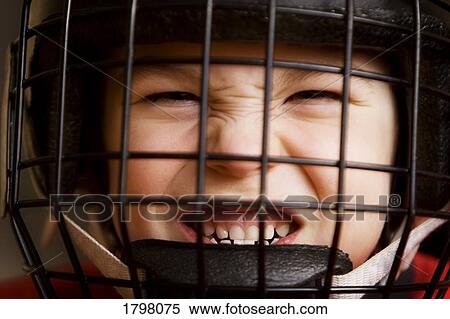 Boy wearing a hockey helmet View Large Photo Image Stock Photography - Boy wearing a hockey helmet. Fotosearch