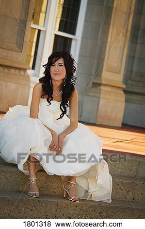 Bride sitting on outside steps in gown View Large Photo Image Stock Photo - Bride sitting on outside steps in gown. Fotosearch
