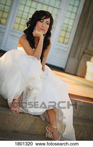 Bride sitting on steps and thinking View Large Photo Image Stock Image - Bride sitting on steps and thinking. Fotosearch