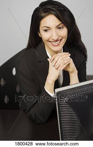 Stock Photo - Business woman at work. Fotosearch