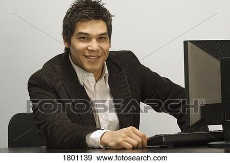 Businessman at computer View Large Photo Image Stock Photo - Businessman at computer. Fotosearch