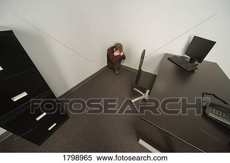Stock Photography - Businessman crying in his office. Fotosearch