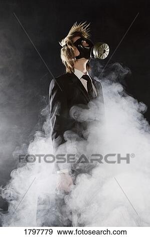 Businessman wearing a gas mask View Large Photo Image Stock Photo - Businessman wearing a gas mask. Fotosearch