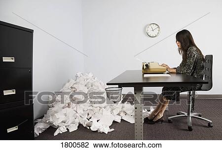 Businesswoman in office with crushed pile of paper on floor View Large Photo Image Stock Image - Businesswoman in office with crushed pile of paper on floor. Fotosearch