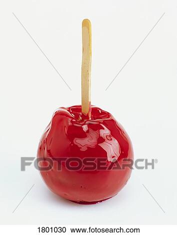 Stock Image - Candied apple on a stick. Fotosearch