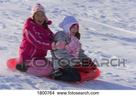 Children tobogganing View Large Photo Image Picture - Children tobogganing. Fotosearch