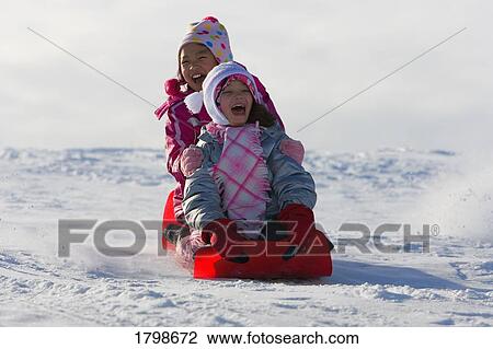 Children tobogganing View Large Photo Image Stock Image - Children tobogganing. Fotosearch