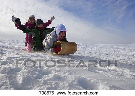 Children tobogganing View Large Photo Image Stock Photography - Children tobogganing. Fotosearch