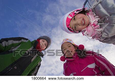 Picture - Children wearing winter clothing. Fotosearch