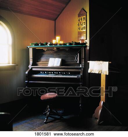 Stock Image - Church piano and pulpit. Fotosearch
