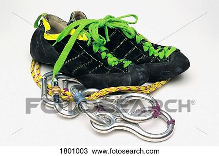 Stock Image - Climbing shoes and equipment. Fotosearch