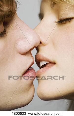 Close-up male & female about to kiss View Large Photo Image Stock Image - Close-up male & female about to kiss. Fotosearch