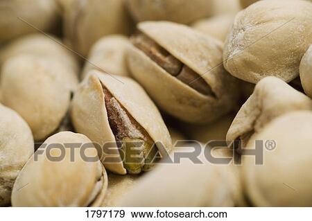 Stock Photo - Closeup of pistachio nuts. Fotosearch