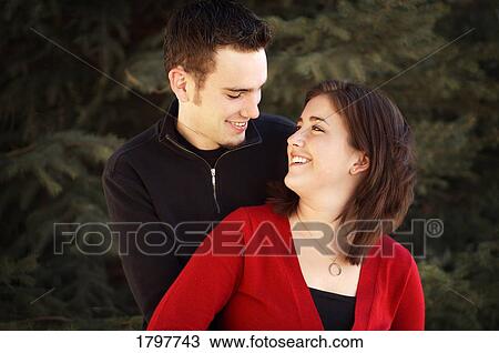 Stock Image - Couple looking at each other. Fotosearch