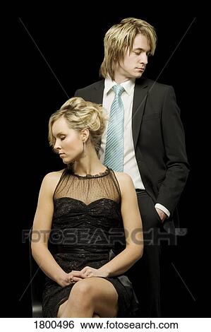 Couple looking away from each other View Large Photo Image Stock Photograph - Couple looking away from each other. Fotosearch