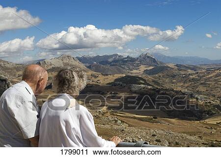 Couple looking out at El Torcal in Antequera, Spain View Large Photo Image Stock Image - Couple looking out at El Torcal in Antequera, Spain. Fotosearch