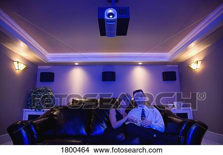 Picture - Couple watching a movie. Fotosearch