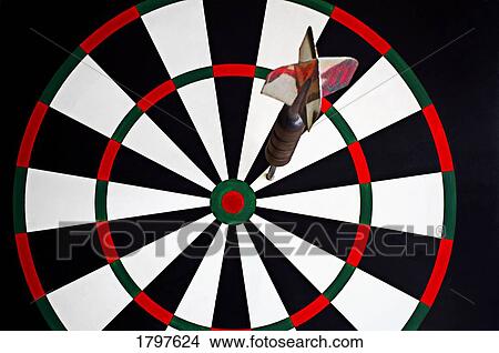 Dart on dartboard View Large Photo Image Picture - Dart on dartboard. Fotosearch