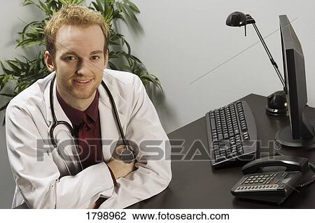 Stock Image - Doctor in his office. Fotosearch
