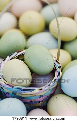 Stock Image - Easter eggs and basket. Fotosearch