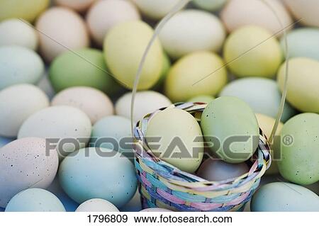 Easter eggs and basket View Large Photo Image Stock Photo - Easter eggs and basket. Fotosearch