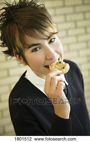 Eating a cookie View Large Photo Image Stock Image - Eating a cookie. Fotosearch