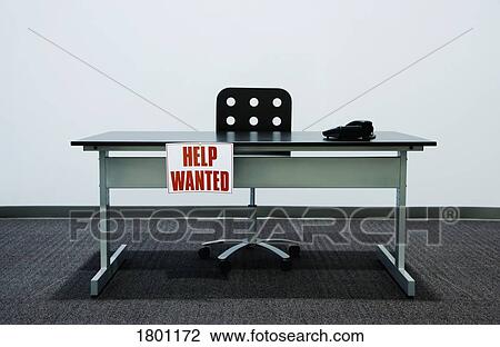 Empty desk with "Help Wanted" sign View Large Photo Image Stock Image - Empty desk with "Help Wanted" sign. Fotosearch