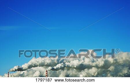 Stock Photo - Factory smoke and blue sky. Fotosearch