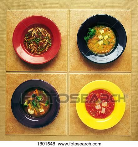 Four plates of different foods View Large Photo Image Stock Photo - Four plates of different foods. Fotosearch