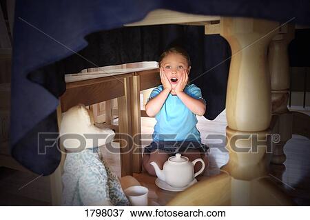 Stock Photo - Girl having a tea party. Fotosearch