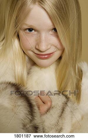 Stock Photo - Girl in a fur coat. Fotosearch