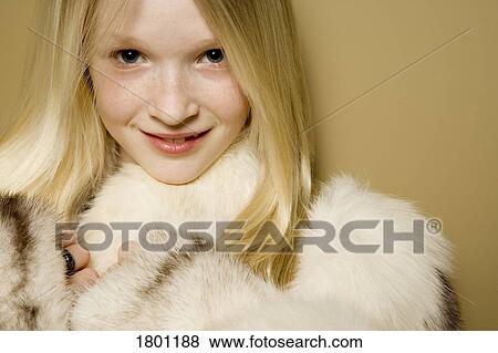 Stock Photo - Girl in a fur coat. Fotosearch
