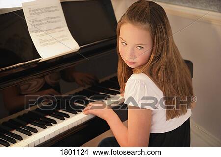 Picture - Girl practising piano . Fotosearch