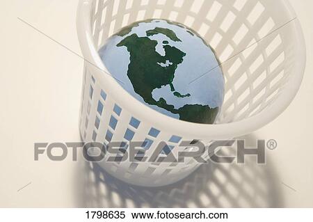 Globe in a garbage bin View Large Photo Image Stock Photography - Globe in a garbage bin. Fotosearch