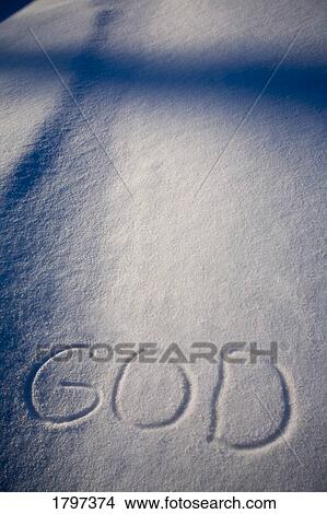 Picture - God written in the snow and a shadow of a cross. Fotosearch