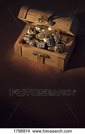 Picture - Golden beads in a box. Fotosearch
