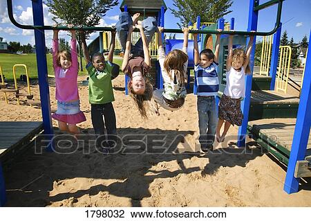 Group of children playing in a park View Large Photo Image Stock Image - Group of children playing in a park. Fotosearch