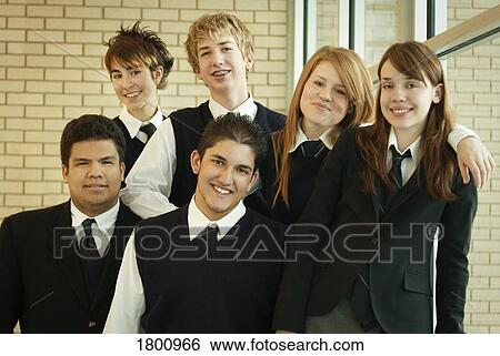 Stock Photograph - Group of kids posing in school uniform. Fotosearch