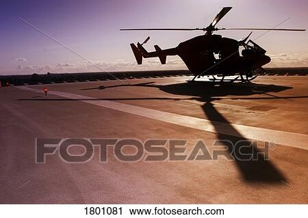 Stock Image - Helicopter on landing pad. Fotosearch