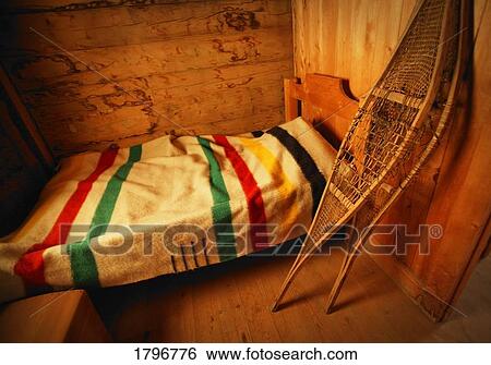 Historical bedroom with HBC blanket and snowshoes View Large Photo Image Stock Photograph - Historical bedroom with HBC blanket and snowshoes. Fotosearch