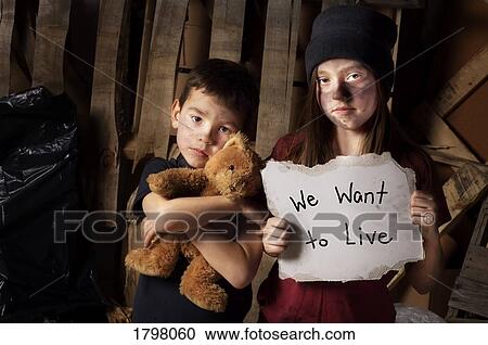 Stock Image - Impoverished boy and girl. Fotosearch