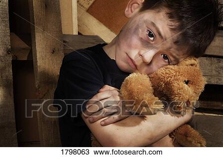 Stock Image - Impoverished boy. Fotosearch