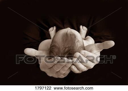 Stock Image - In the Father's hands. Fotosearch