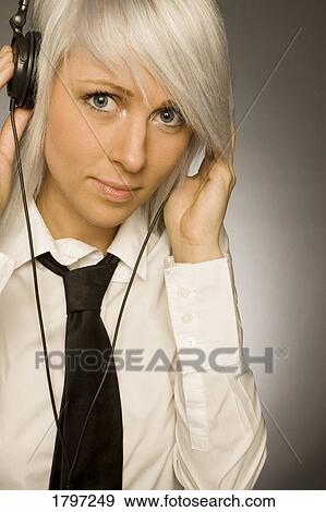 Listening to headphones View Large Photo Image Stock Photo - Listening to headphones. Fotosearch
