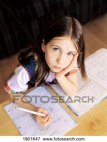 Little girl doing homework View Large Photo Image Stock Photo - Little girl doing homework. Fotosearch