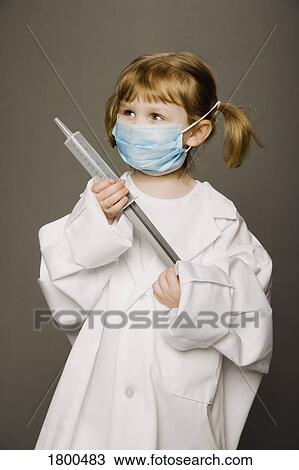 Stock Image - Little Girl Dressed Like A Doctor. Fotosearch