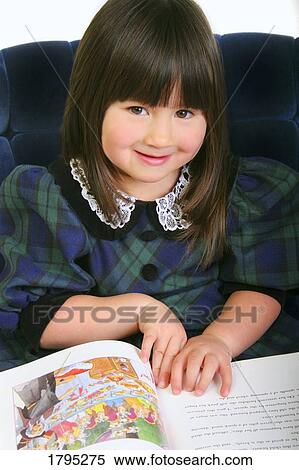 Stock Photography - Little girl reading a story. Fotosearch
