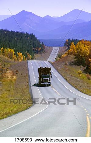 Stock Image - Logging truck in Alberta, Canada. Fotosearch