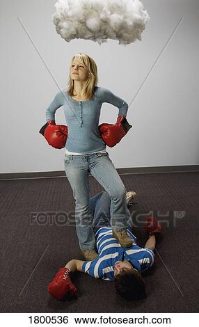Male and female fighting under cloud View Large Photo Image Stock Photograph - Male and female fighting under cloud. Fotosearch